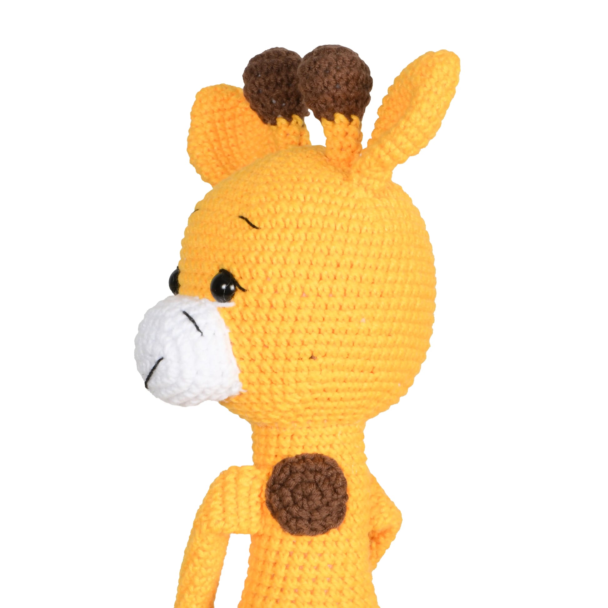 Handmade crochet amigurumi toy of a cute giraffe with a long neck and delightful details.