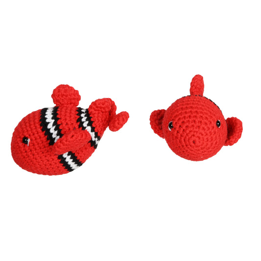 Handmade crochet amigurumi toy of a red fish with vibrant scales and cute, whimsical details.